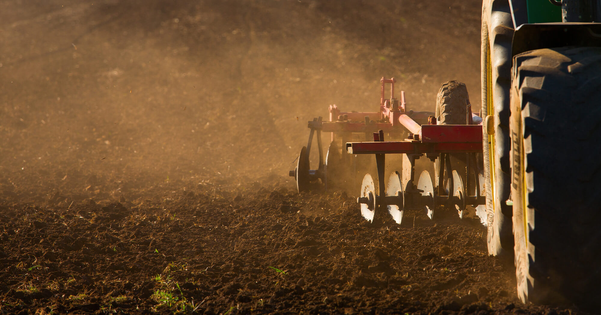 Tractor Tilling Field